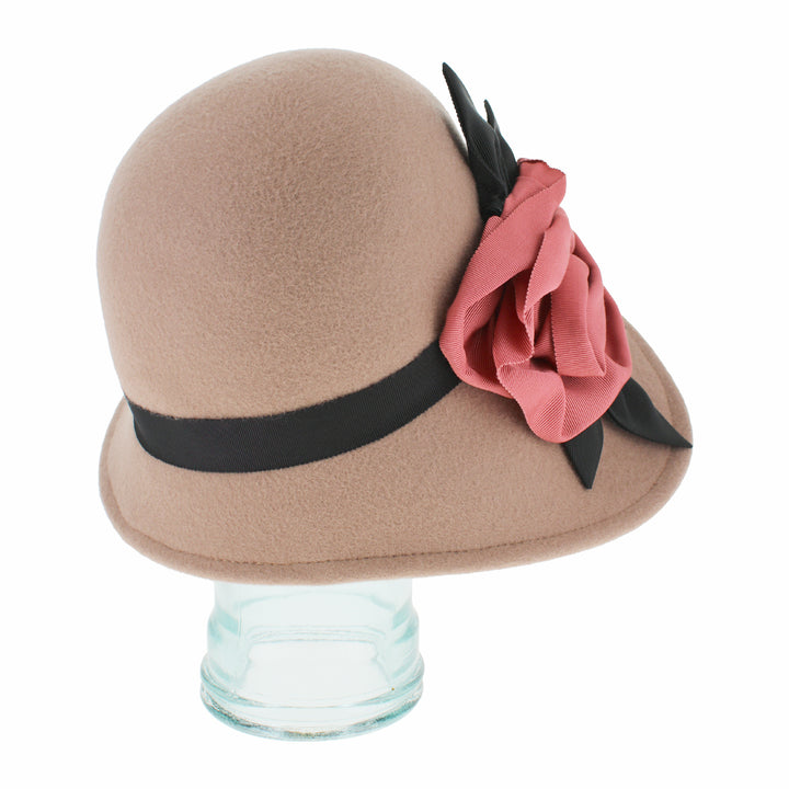Side profile of the Belfry Woodhouse women’s cloche hat in taupe wool with asymmetrical brim and grosgrain ribbon flower, a timeless accessory for autumn and winter fashion
