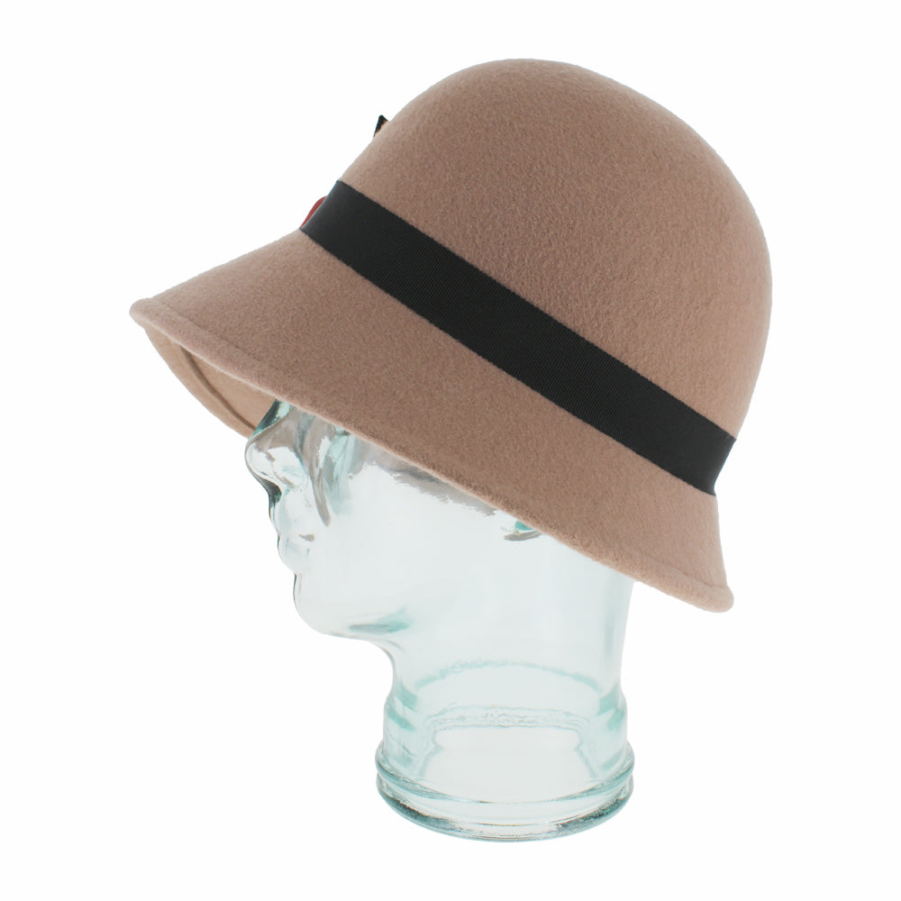 Angled view of the Belfry Woodhouse taupe asymmetrical cloche hat in wool with ribbon flower trim, a sophisticated accessory blending warmth, comfort, and autumn/winter charm