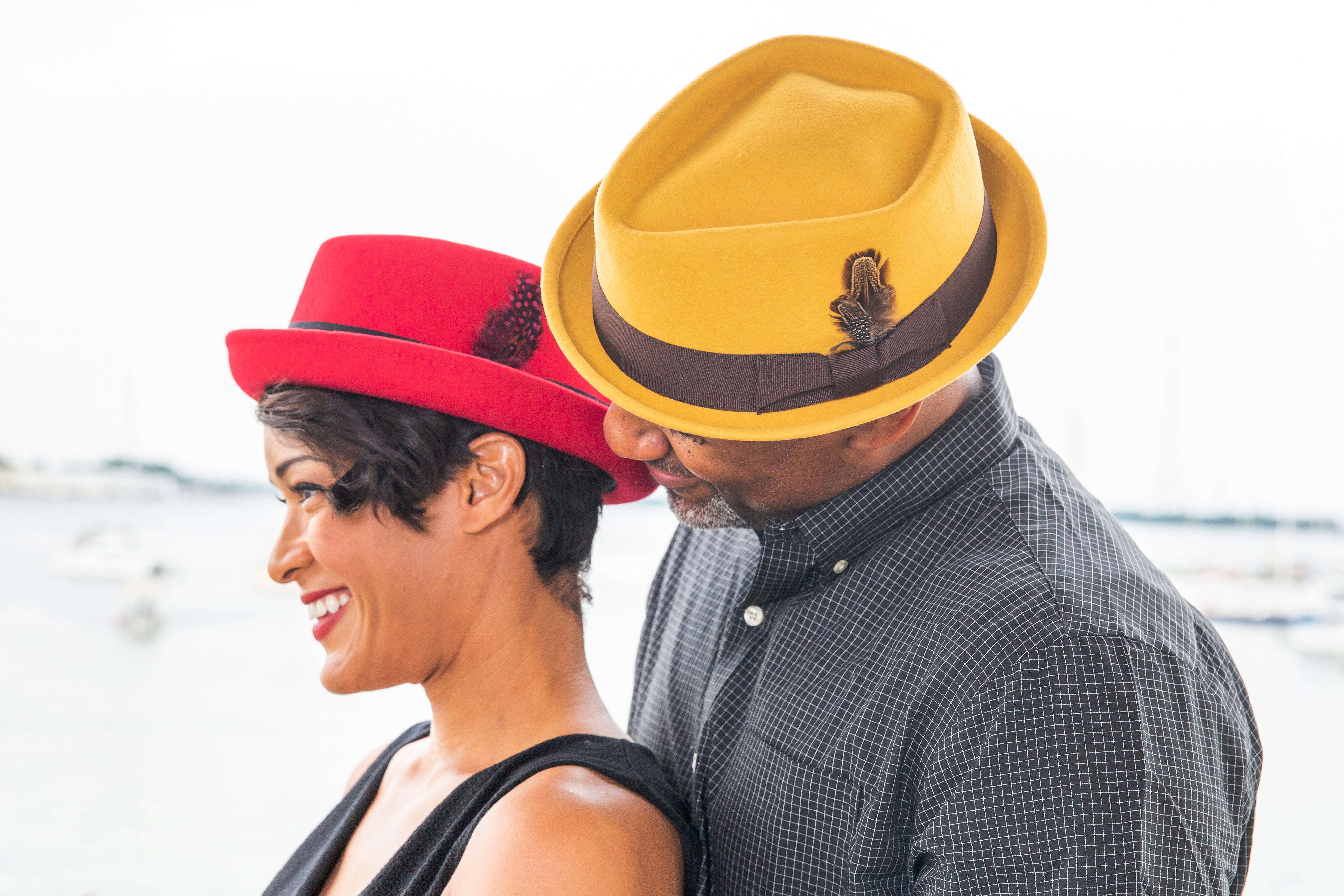 a couple wearing hats