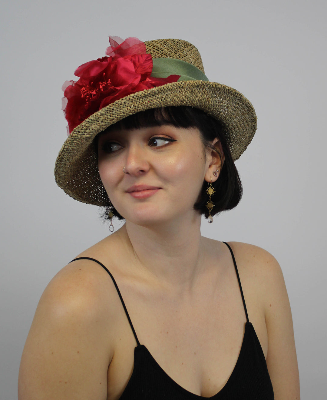 Woman in Straw hat with pink flower